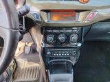 a car dashboard with a clock on it and a steering wheel