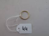 a tag with the word wu on it and a gold ring