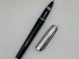 an image of a pen and a ballpoint pen on a white surface