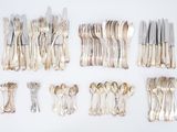 a lot of forks and spoons on the table