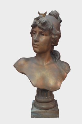 a bronze bust of a woman with a bird on her head