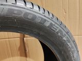 a close up of a tire on a cardboard box with a cardboard box in the background