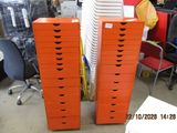 many stacks of orange boxes stacked on top of each other