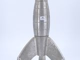 silver metal model of a space rocket on a white background