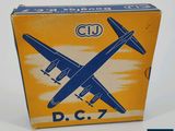 an old blue and yellow box with a small plane on it
