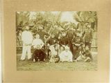 an old photo of a group of people posing for a picture