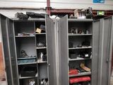 a garage with two metal cabinets and a bike in it