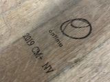 a close up of a piece of wood with a smiley face on it