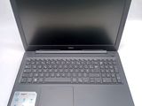 an open laptop computer sitting on top of a white table