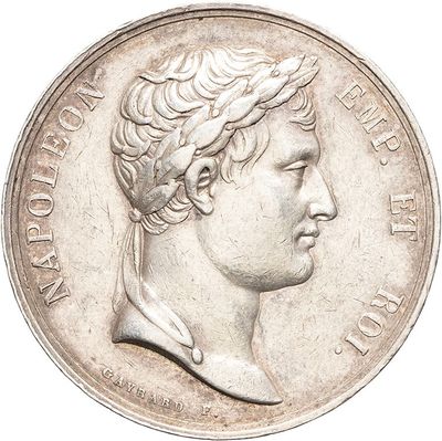 an old silver coin with a bust of a man on it
