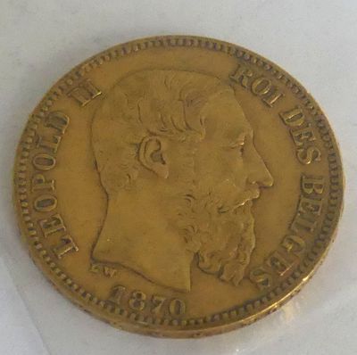 a gold coin with a picture of a man on it