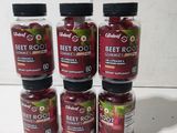 six bottles of beet root gummies sit on a table