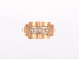 a close up of a gold ring with diamonds on a white background