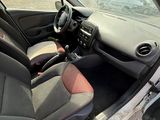 the interior of a car with the door open and the driver ' s seat down