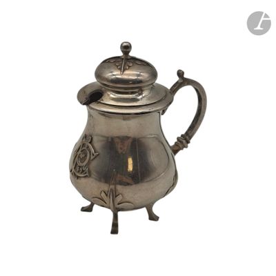 a silver tea pot with a bird on top of it