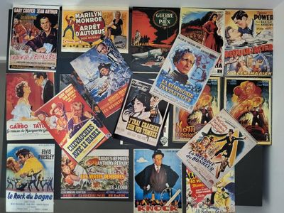 many movie posters on the wall of a room