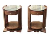 pair of round end tables with glass top and wooden base