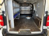 a white van with a bed in the back of it
