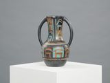 a vase that is sitting on top of a white pedestal