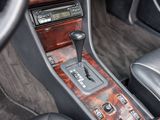 a close up of a car ' s interior with a gear stick