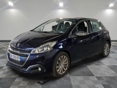 a blue car is parked in a room with a checkered floor