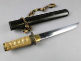 a knife that is laying on a table