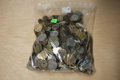 a bag of coins sitting on a table with a price tag on it