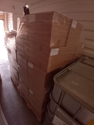 boxes stacked on top of each other in a storage room