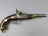 a close up of a gun on a table with a white background