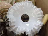 a white bowl with a hole in it sitting in a box