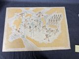 une photo d'un dessin représentant une maison posée sur une table
