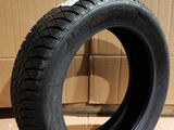 a close up of a tire on a cardboard box on a floor