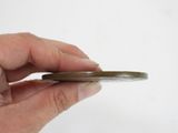 a person holding a piece of metal in their hand