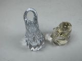 two silver vases sitting next to each other on a table