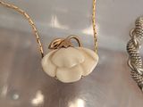 two necklaces that are sitting on a table