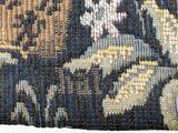 an image of a close up of a tapestry with a cat on it