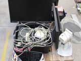 a pile of electronics sitting on the ground next to a fan