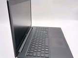 a laptop that is sitting on a white surface