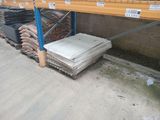 many stacks of tile on the shelves in the warehouse