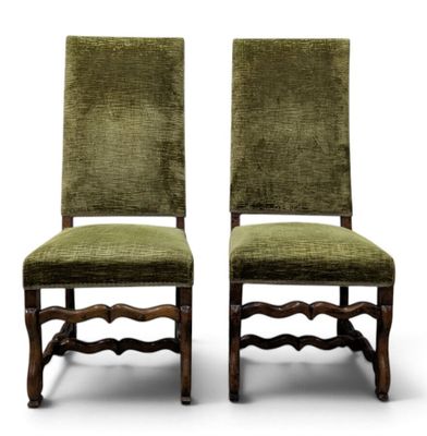 a pair of green upholstered chairs on a white background