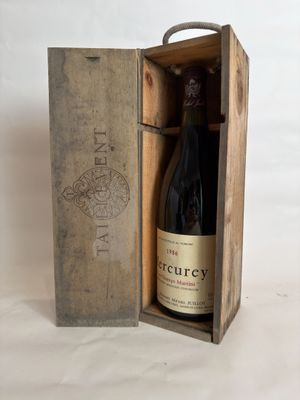 a wooden box with a bottle of wine inside of it