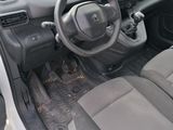 dashboard view of a car with a steering wheel and dashboard controls
