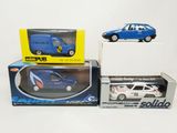 three toy cars that are sitting on top of each other