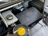 the engine compartment of a car with the hood open and the hood open