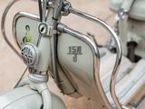 a close up of a motor scooter parked on the street