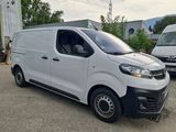 a white van that is parked in the parking lot