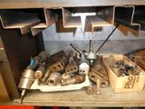 a lot of tools that are sitting on a shelf