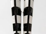 pair of black and white high heeled boots on a white background