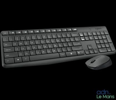 a computer keyboard and mouse sitting next to each other