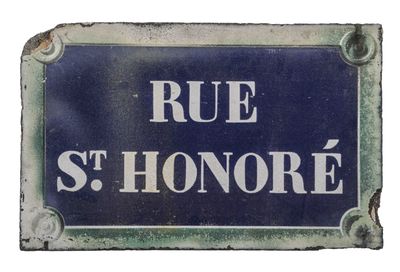 a blue sign that says rue st honore on it